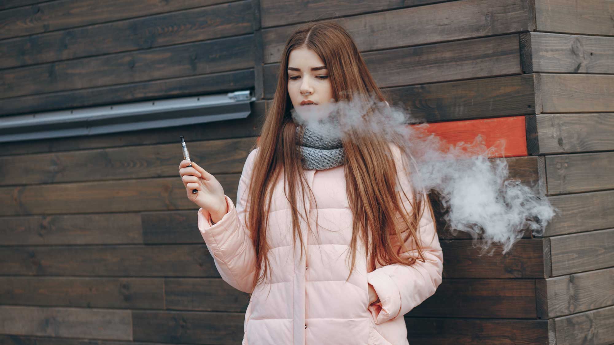 a young woman vaping